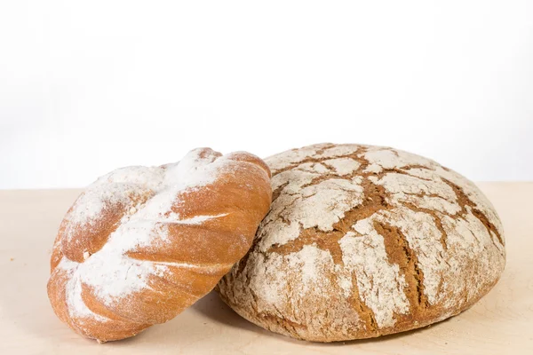 Baked bread on wood table — Stock Photo, Image