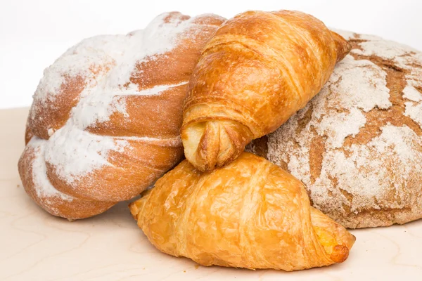 Baked bread on wood table — Stock Photo, Image