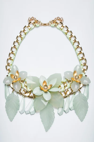 Plastic necklace. beige flower — Stock Photo, Image