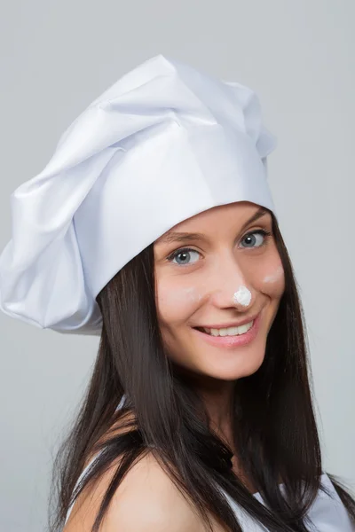 Ritratto di una cuoca sorridente che fa gesti — Foto Stock