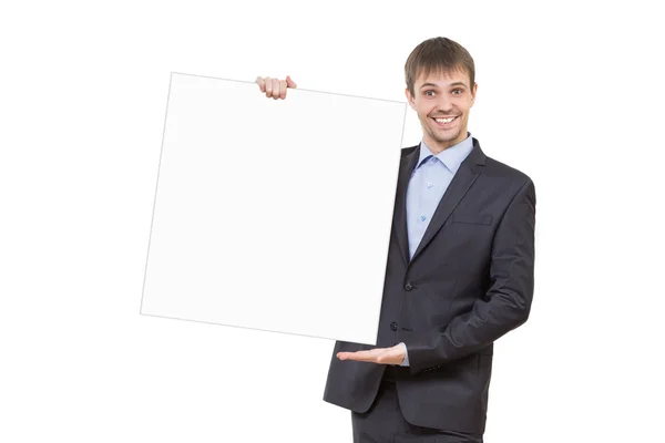 Smiling business man showing blank signboard Royalty Free Stock Photos