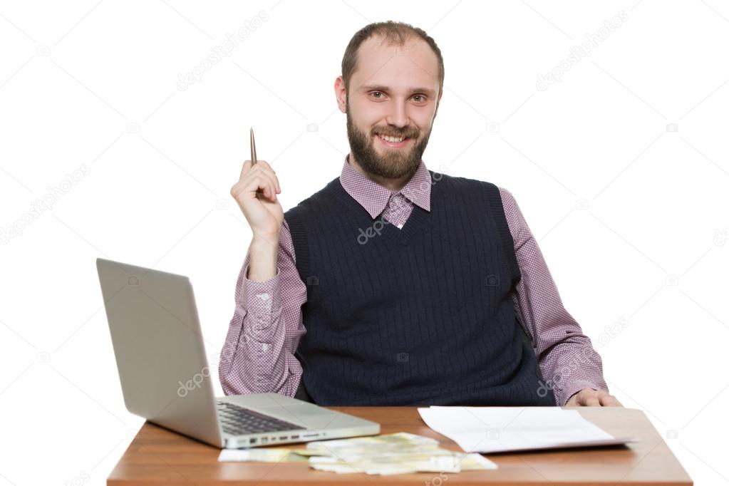 businessman in front of his desk and laptop
