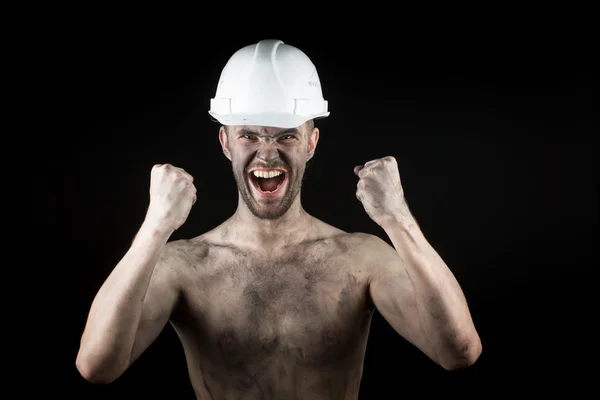 Happy dirty worker in helmet. — Stock Photo, Image