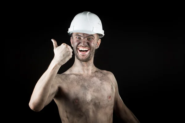 Happy dirty worker in helmet. — Stock Photo, Image