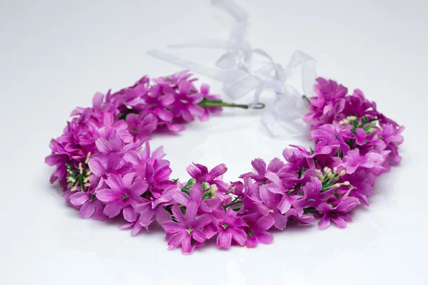 Tiara of artificial  roses on a light background — Stock Photo, Image