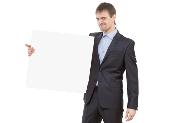 Sorridente homem de negócios mostrando placa em branco — Fotografia de Stock