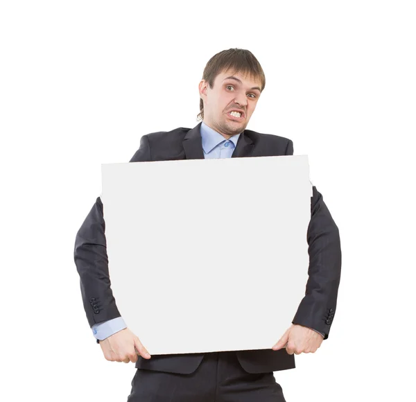 Looking smiling business man showing blank signboard — Stock Photo, Image