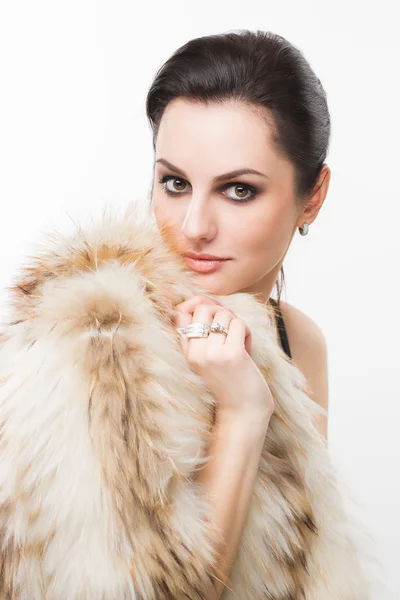 Portrait of beautiful girl in furs, rings — Stock Photo, Image