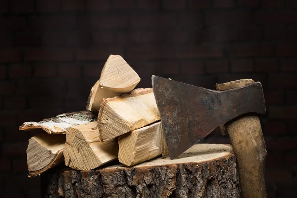 Birch firewood, old rusty ax — Stock Photo, Image