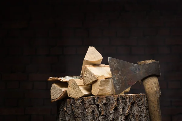 Birch firewood, old rusty ax — Stock Photo, Image