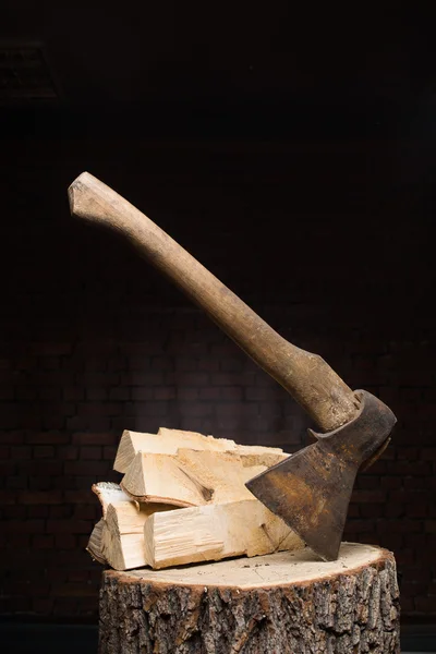 Birch firewood, old rusty ax — Stock Photo, Image