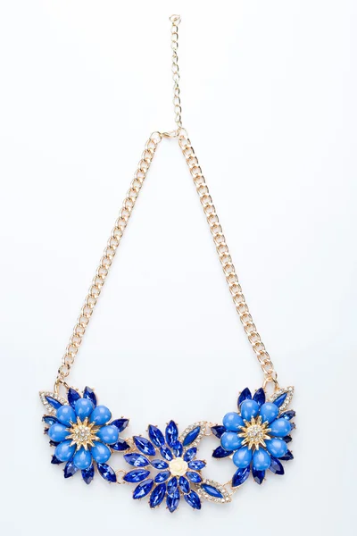 Plastic necklace. three blue flower — Stock Photo, Image