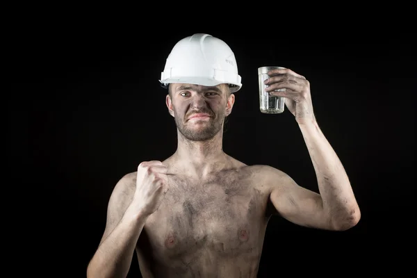 A miner with a glass of vodka — Stock Photo, Image