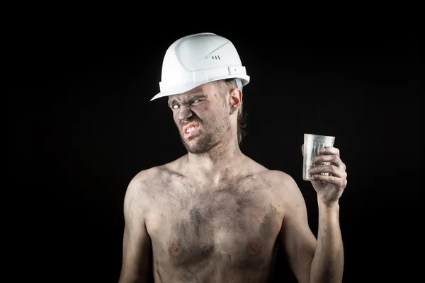 Angry working in a dirty helmet — Stock Photo, Image