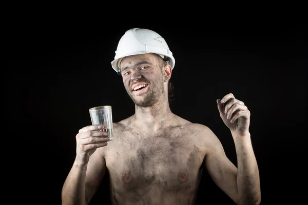 Happy dirty worker in helmet. — Stock Photo, Image