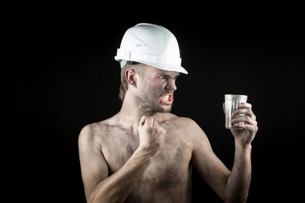 Angry working in a dirty helmet — Stock Photo, Image