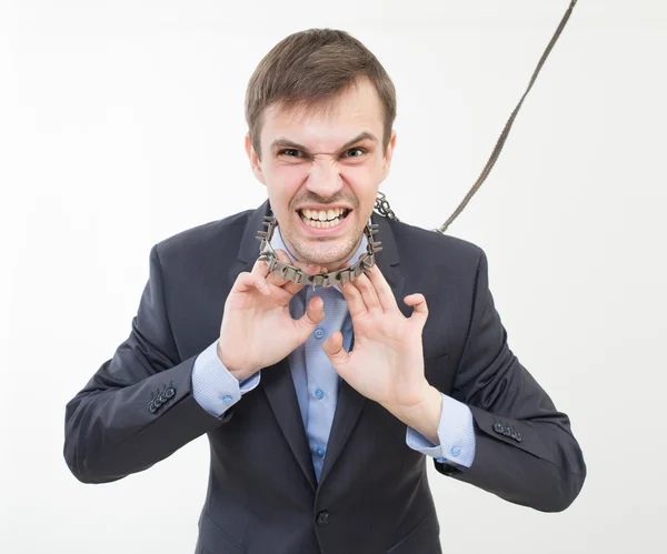 Enojado hombre de negocios en la cadena con un collar . — Foto de Stock