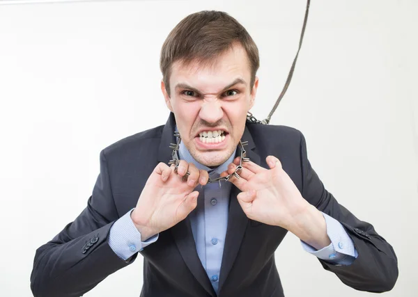 Angry businessman on the chain with a collar. — Stock Photo, Image