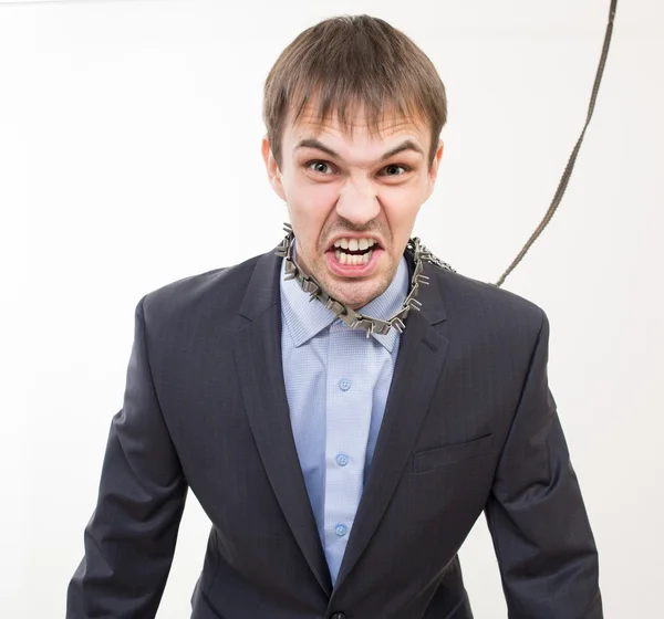 Angry businessman on the chain with a collar. — Stock Photo, Image