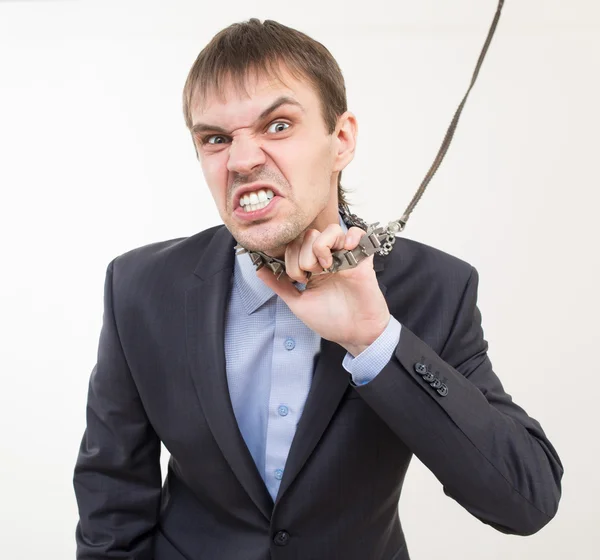 Angry businessman on the chain with a collar. — Stock Photo, Image