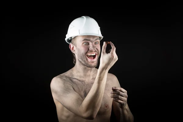 Happy dirty worker in helmet. gemstone, — Stock Photo, Image