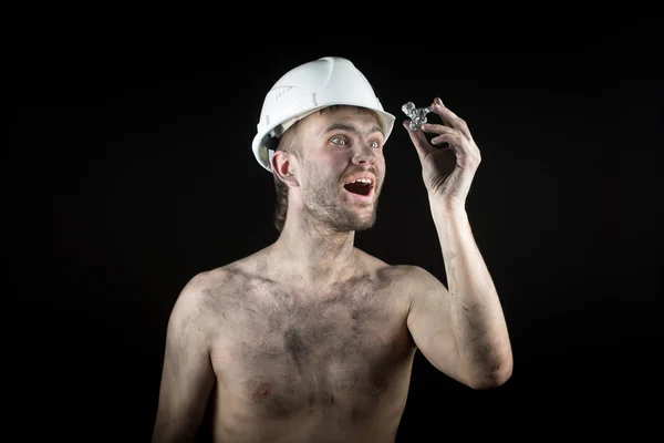 Happy dirty worker in helmet. gemstone, — Stock Photo, Image