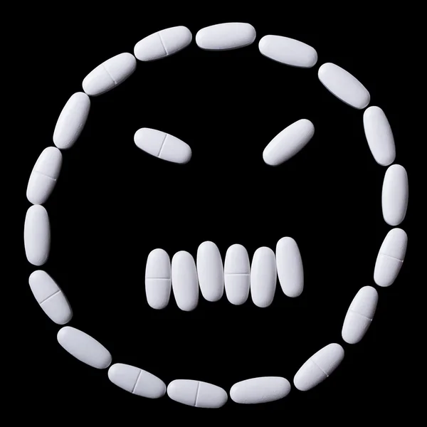 Face of white oblong tablets — Stock Photo, Image