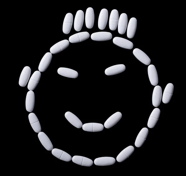 Face of white oblong tablets — Stock Photo, Image