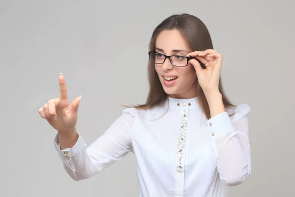 Business woman fingret pekar på sidan. — Stockfoto