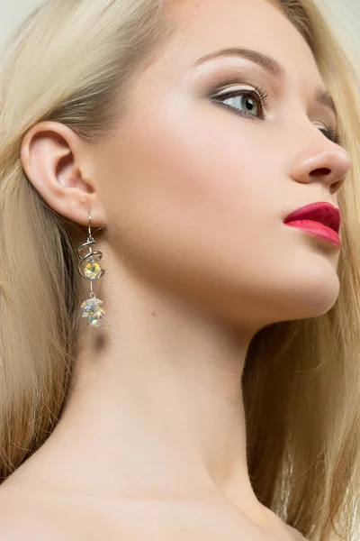 Beautiful girl with red lips and earrings. fashion photo Stock Picture