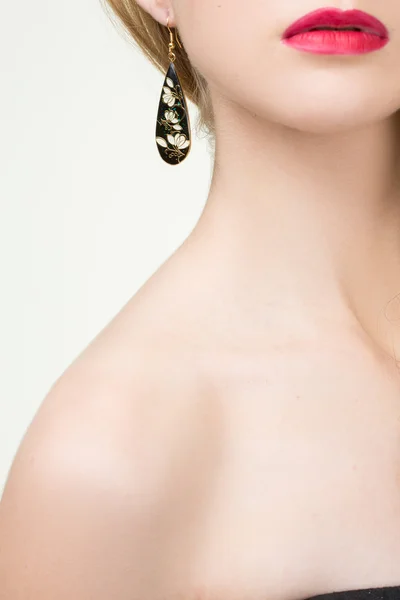 Close up of woman wearing shiny diamond earrings — Stock Photo, Image