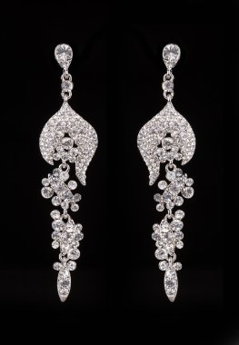earrings with jewels on the black