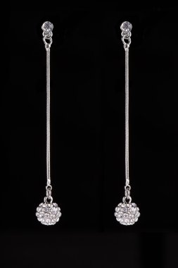 earrings with jewels on the black