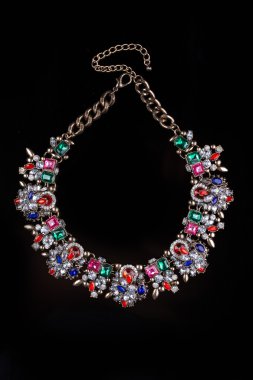 luxury red necklace on black stand
