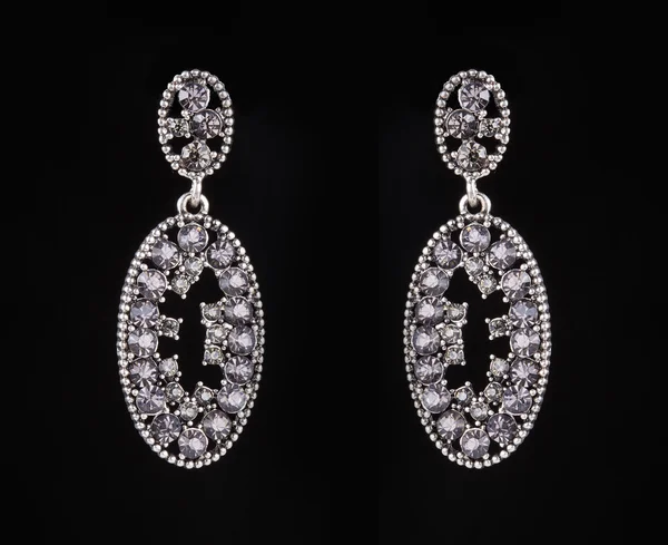 Earrings with jewels on the black — 스톡 사진