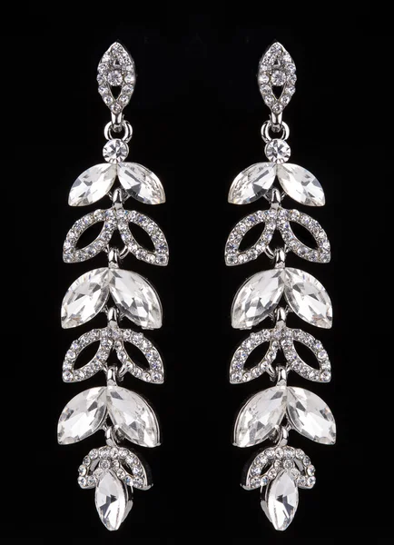 Earrings with jewels on the black — Stock Fotó