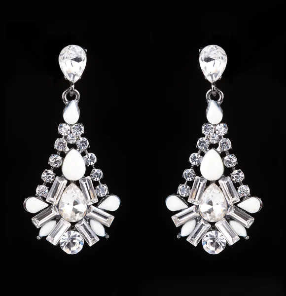 Earrings with jewels on the black — Stock Photo, Image