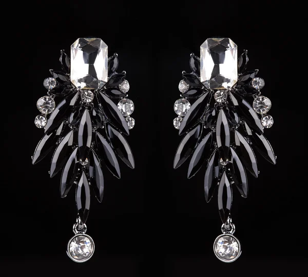 Earrings with jewels on the black — Stock Photo, Image