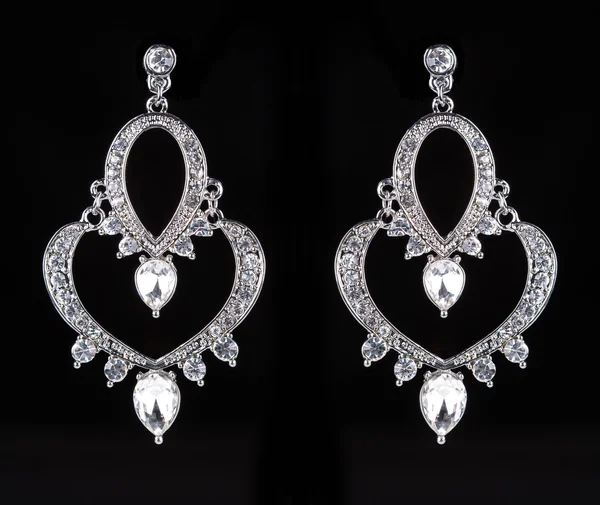 Earrings with jewels on the black — 图库照片