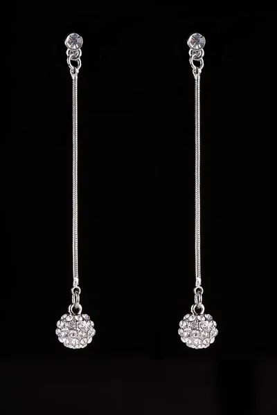 Earrings with jewels on the black — 图库照片