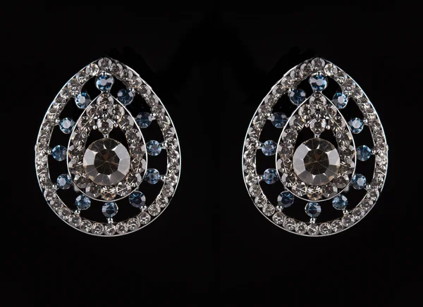 Earrings with jewels on the black — 스톡 사진