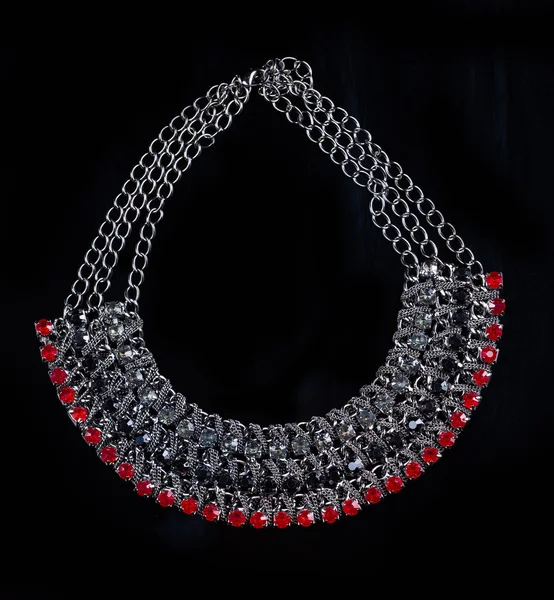 Luxury red necklace on black stand — Stockfoto