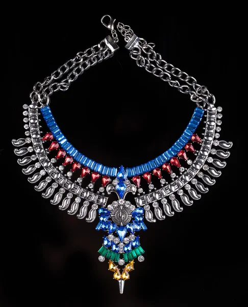 Metal necklace with red and blue stones — 스톡 사진