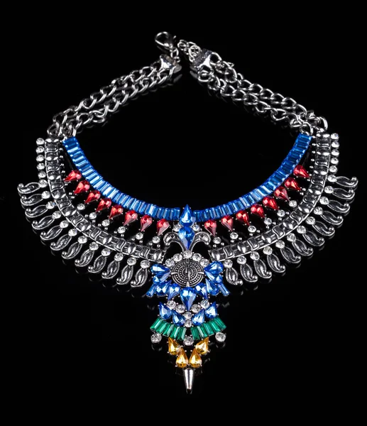Metal necklace with red and blue stones — Stock Photo, Image