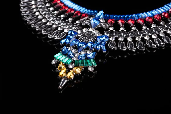 Metal necklace with red and blue stones — Stok fotoğraf