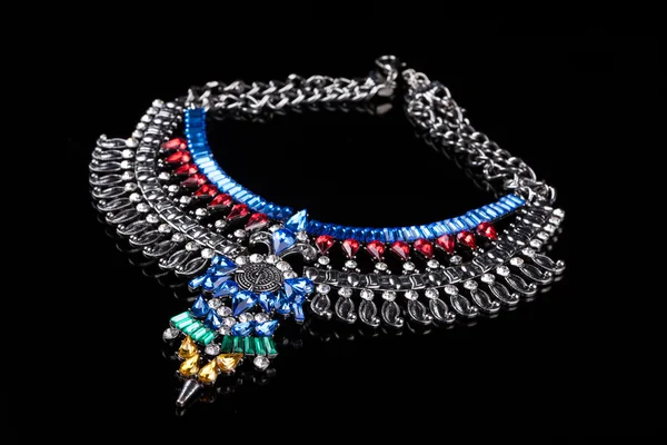 Metal necklace with red and blue stones — 스톡 사진