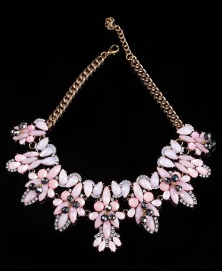 luxury pink necklace on black stand