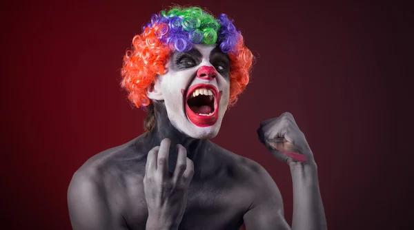 Crazy clown  with a knife — Stock Photo, Image