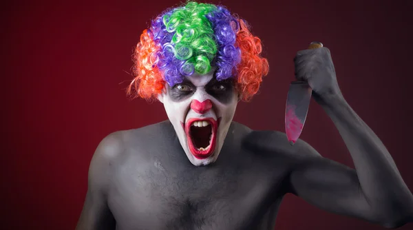 Crazy clown med en kniv — Stockfoto