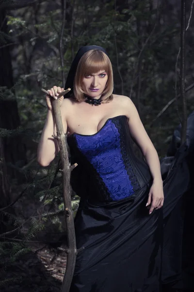 Witch girl in forest — Stock Photo, Image